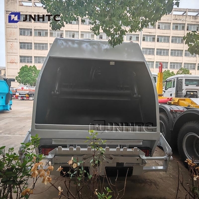 HOWO camion spazzatura Compattatore 4x2 Euro 2 Dispositivo rifiuti Riempitore posteriore di rifiuti camion verde diesel Modello nuovo